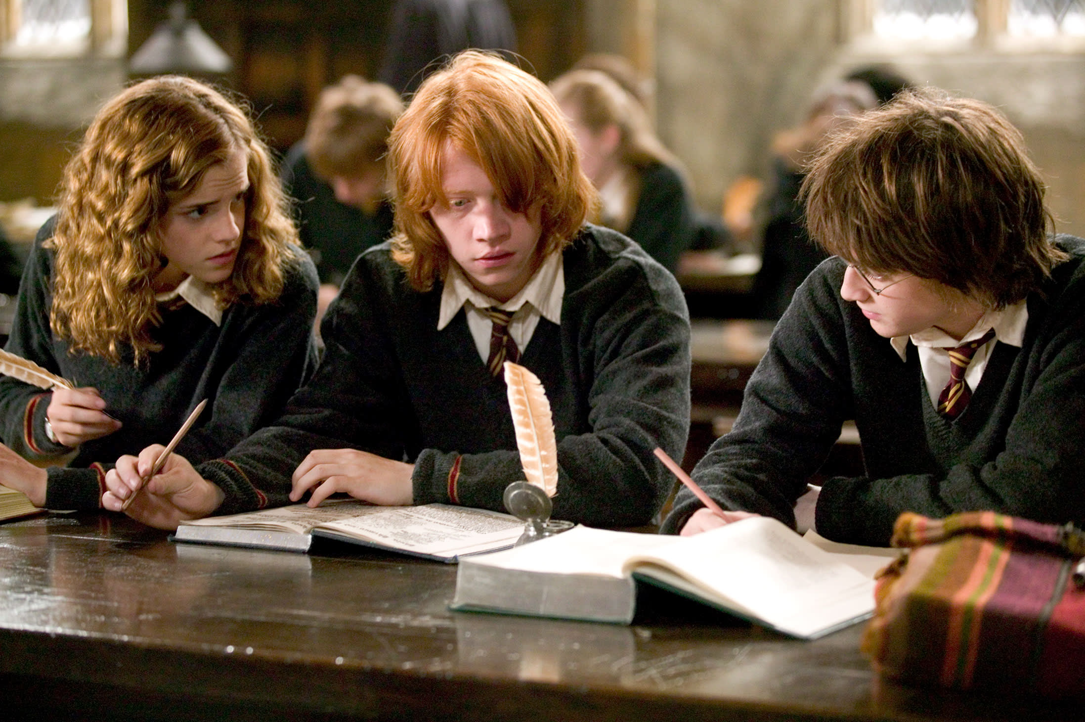WB-HP-F4-goblet-of-fire-harry-ron-hermione-with-quills